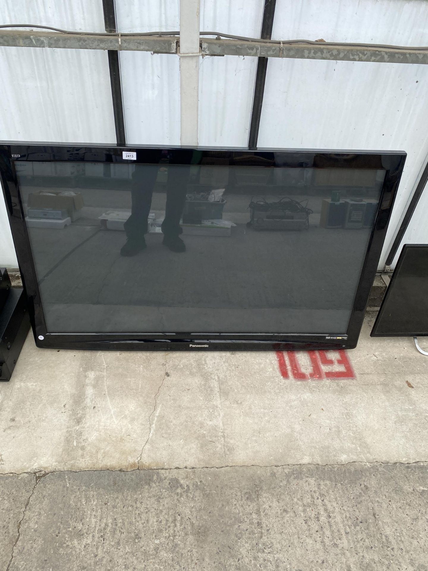 A PANASONIC 50" TELEVISION WITH WALL MOUNTING BRACKET