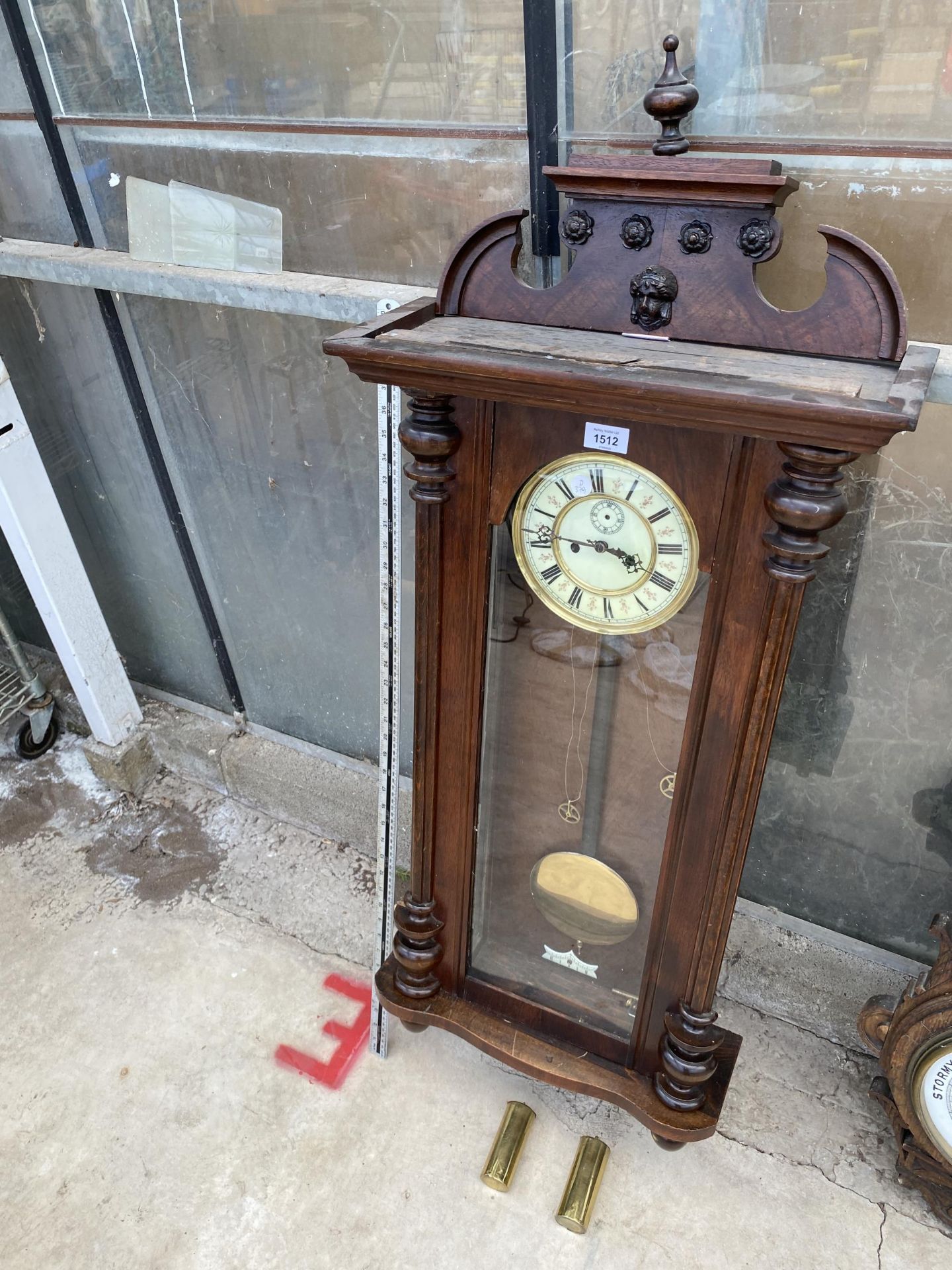 A DECORATIVE VIENNA STYLE MAHOGANY CHIMING WALL CLOCK