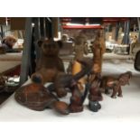 A COLLECTION OF CARVED WOODEN ANIMALS AND FIGURES