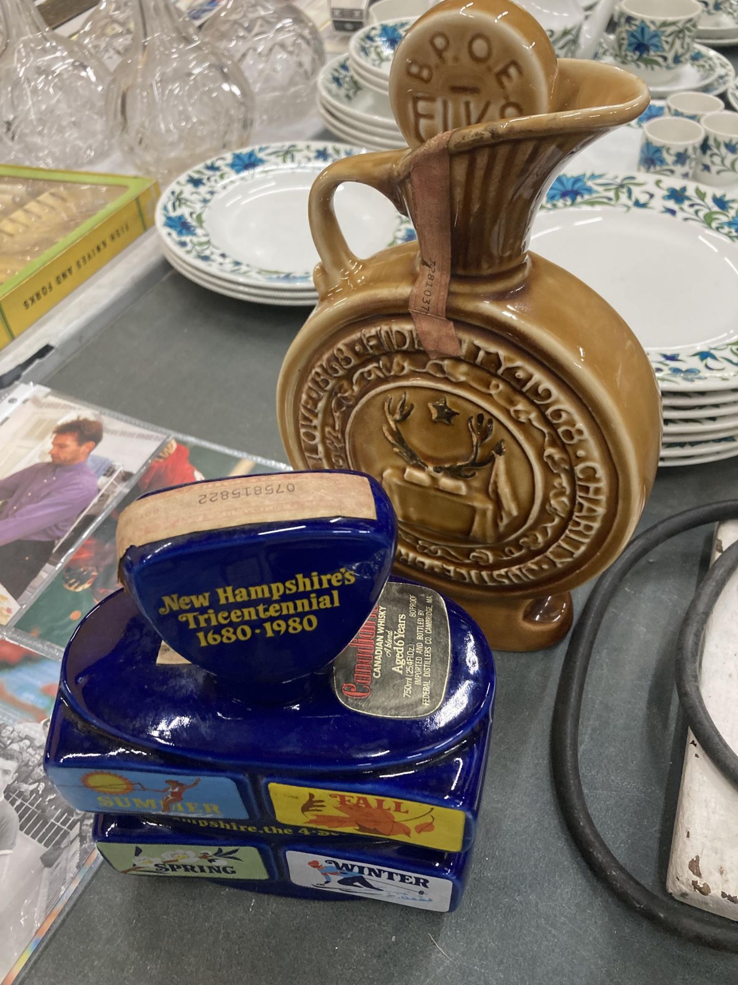 TWO AMERICAN CERAMIC DECANTERS , JIM BEAM CENTENNIAL AND CANADIAN RUM, NEW HAMPSHIRE TRI CENTENNIAL