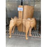 A PAIR OF WOODEN CARVED ELEPHANT BOOK ENDS