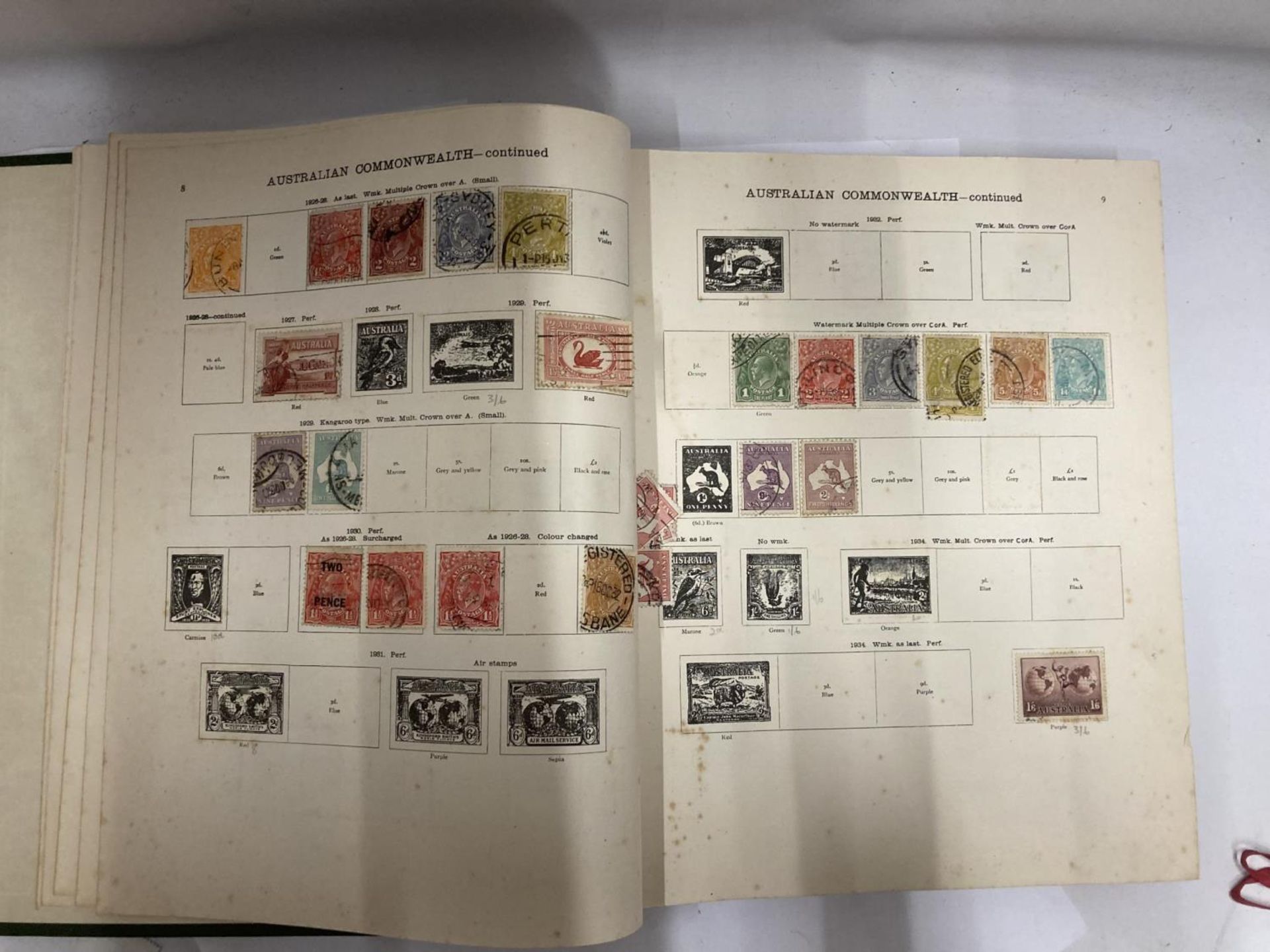 THE NEW IDEAL POSTAGE STAMP ALBUM CONTAINING BRITISH, WORLD AND COMMONWEALTH STAMPS TO INCLUDE A