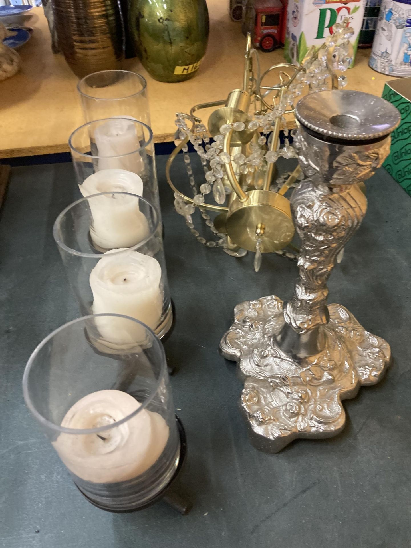 A LARGE METAL CANDLE HOLDER HOLDING FOUR LARGE CANDLES IN GLASS HOLDERS, A LARGE SILVER COLOURED - Image 2 of 5