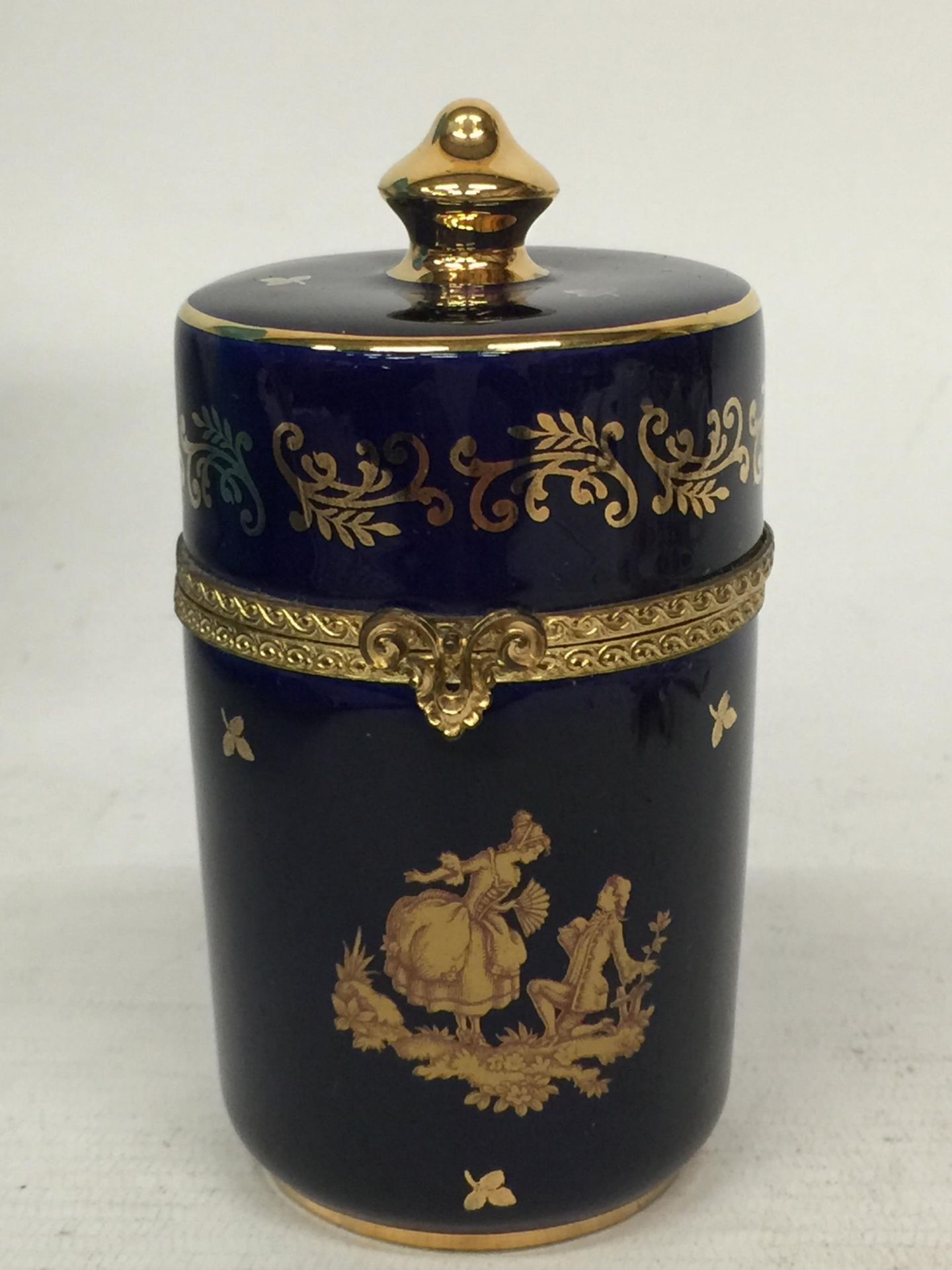 A LIMOGES CASTEL FRANCE 22K GOLD COBALT BLUE WITH GOLD SCROLL ACCENTS LOVERS PORCELAIN BOX WITH