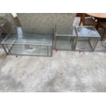 A MODERN POLISHED STEEL FRAMED COFFEE TABLE, 49 X 33" AND A PAIR OF MATCHING LAMP TABLES, 21.5"