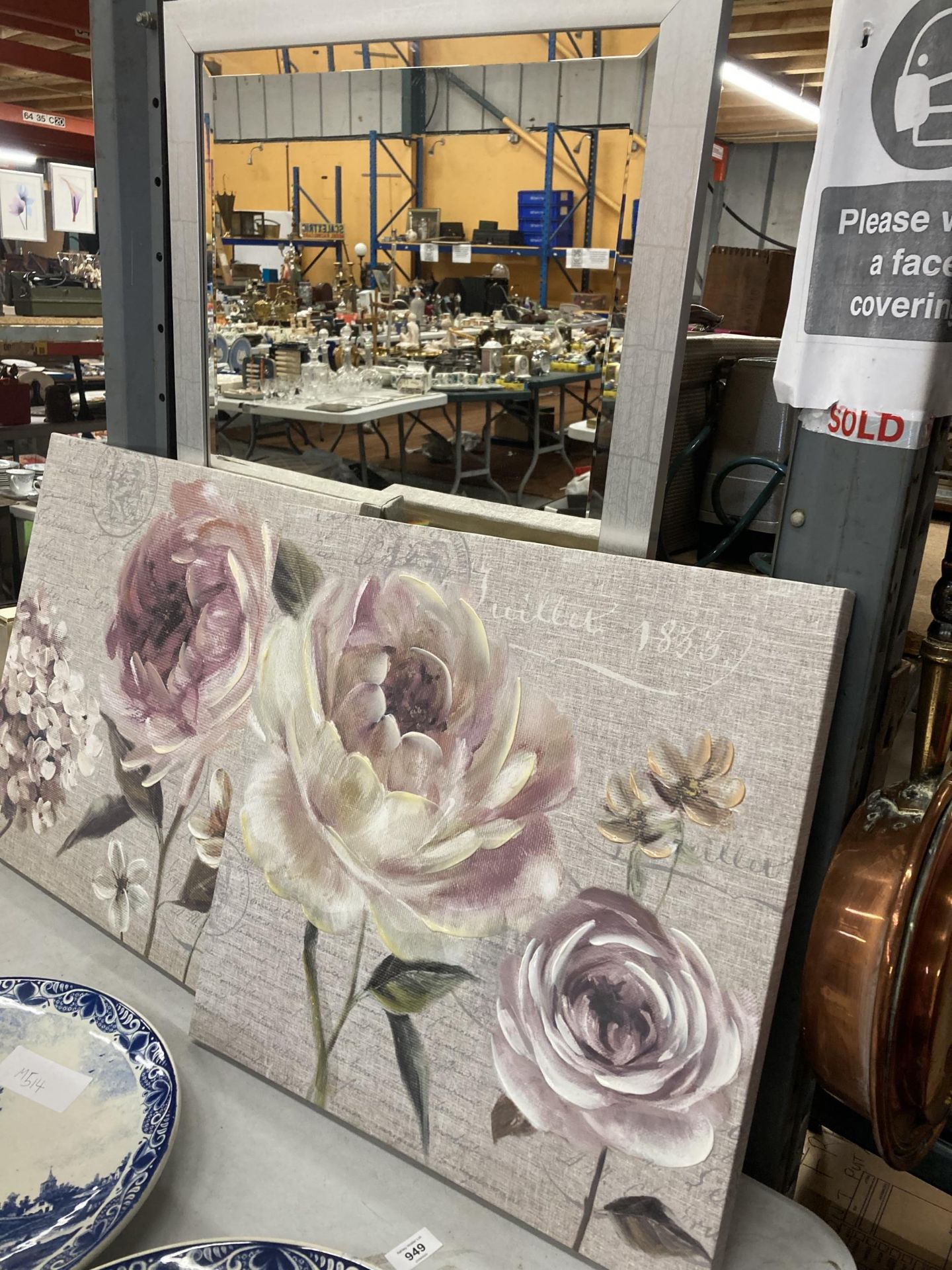 A PAIR OF MODERN FLORAL CANVAS PRINTS AND A MODERN MIRROR