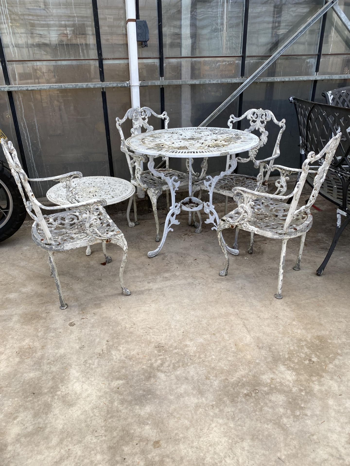 A VINTAGE CAST ALLOY BISTRO SET COMPRISING OF A ROUND TABLE, FOUR CARVER CHAIRS AND A COFFEE TABLE - Image 2 of 5