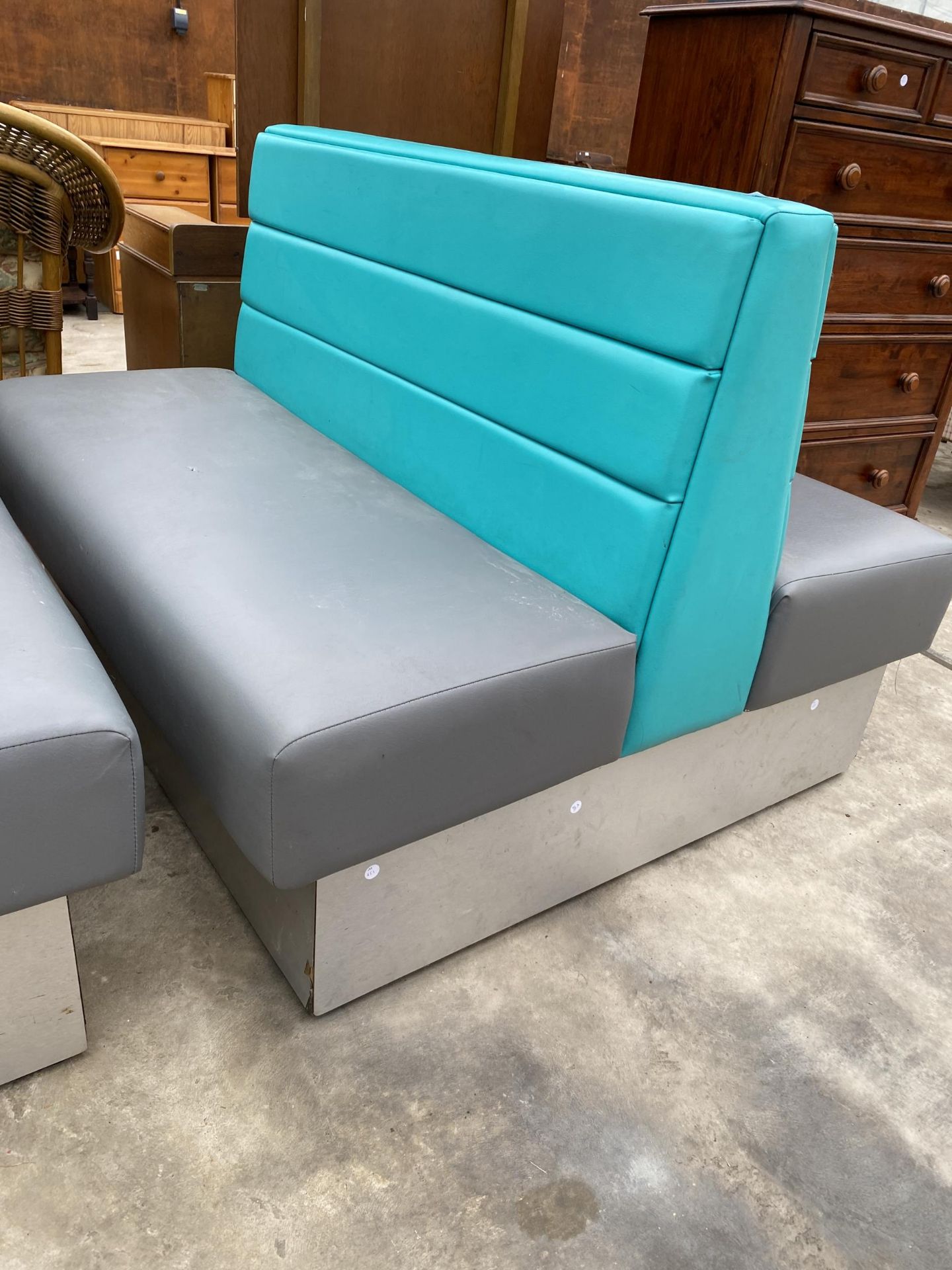 A MODERN DOUBLE SIDED BOOTH SEATING IN TURQUOISE AND GREY