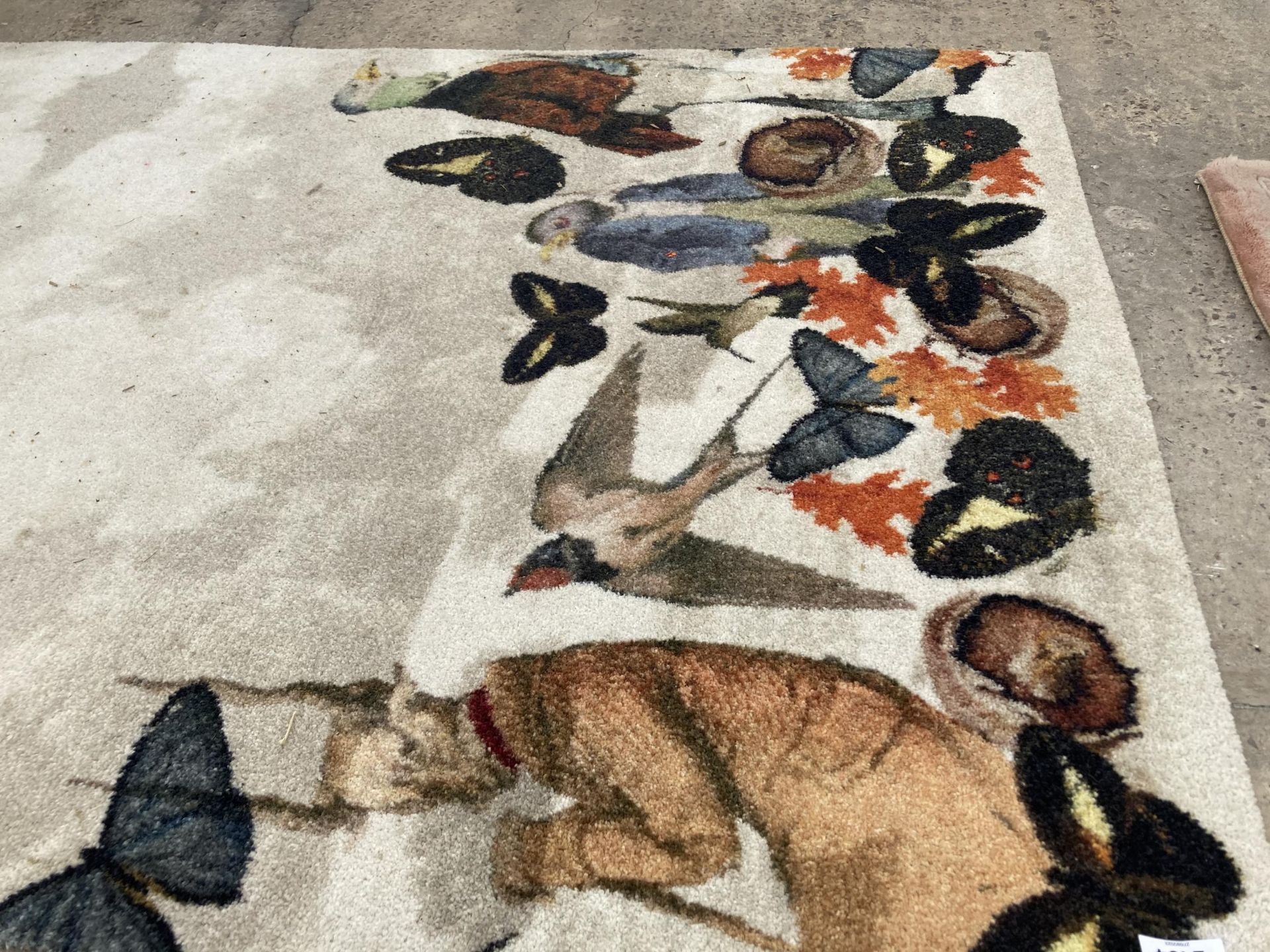 A MODERN RUG WITH ANIMAL DESIGN - Image 2 of 3