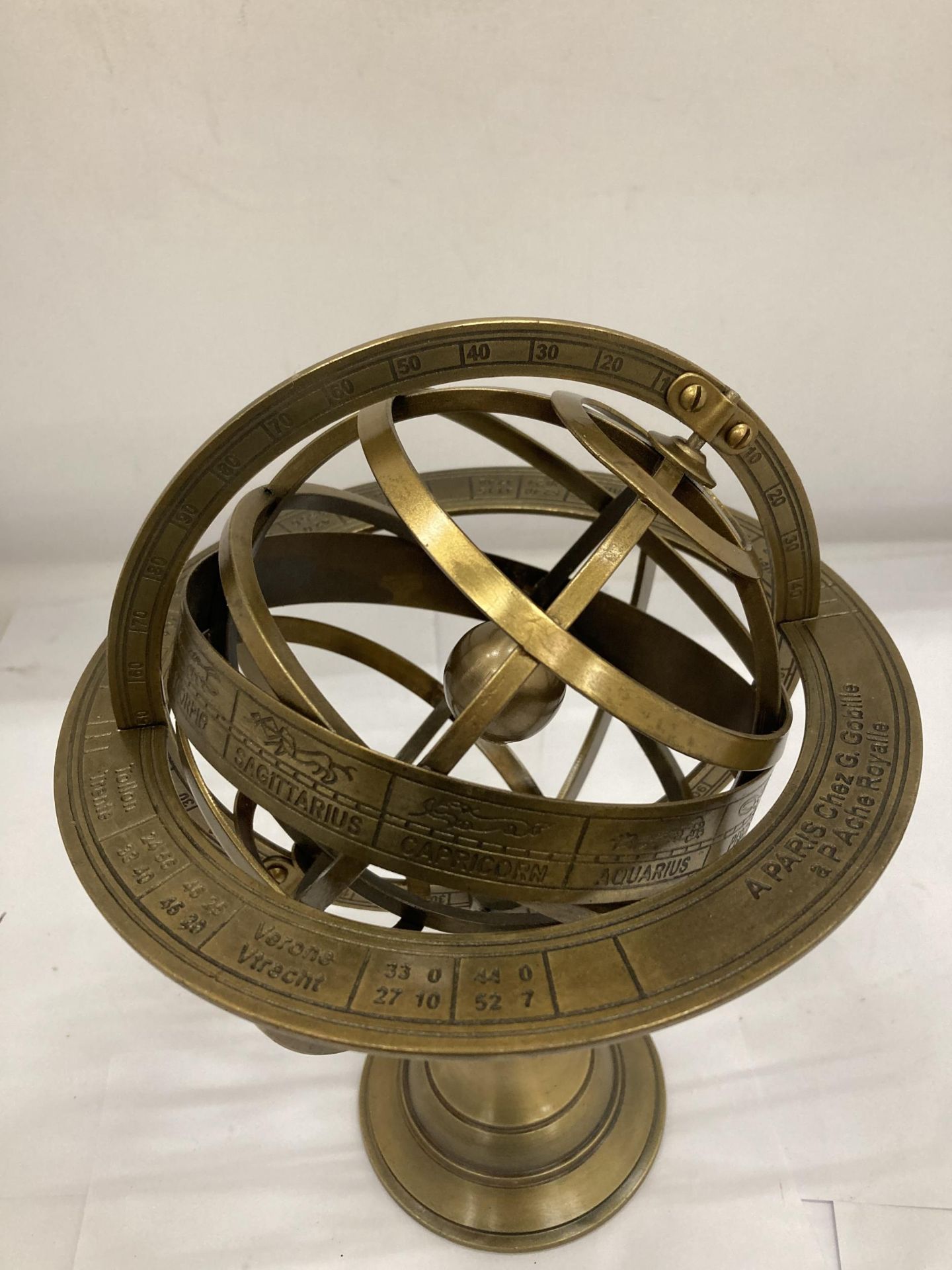 A BRASS DESK REVOLVING GLOBE STYLE COMPASS WITH BIRTH SIGNS - Image 2 of 3