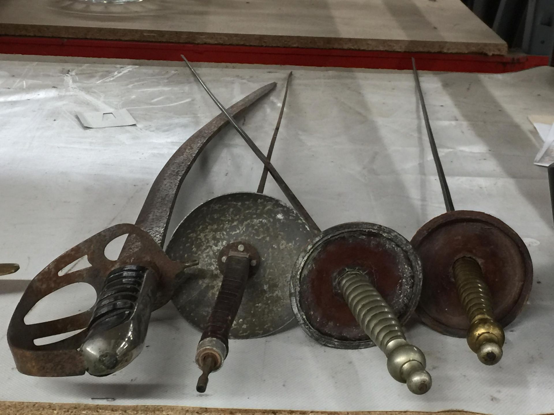 A GROUP OF THREE FENCING FOILS AND CAVALRY STYLE SWORD