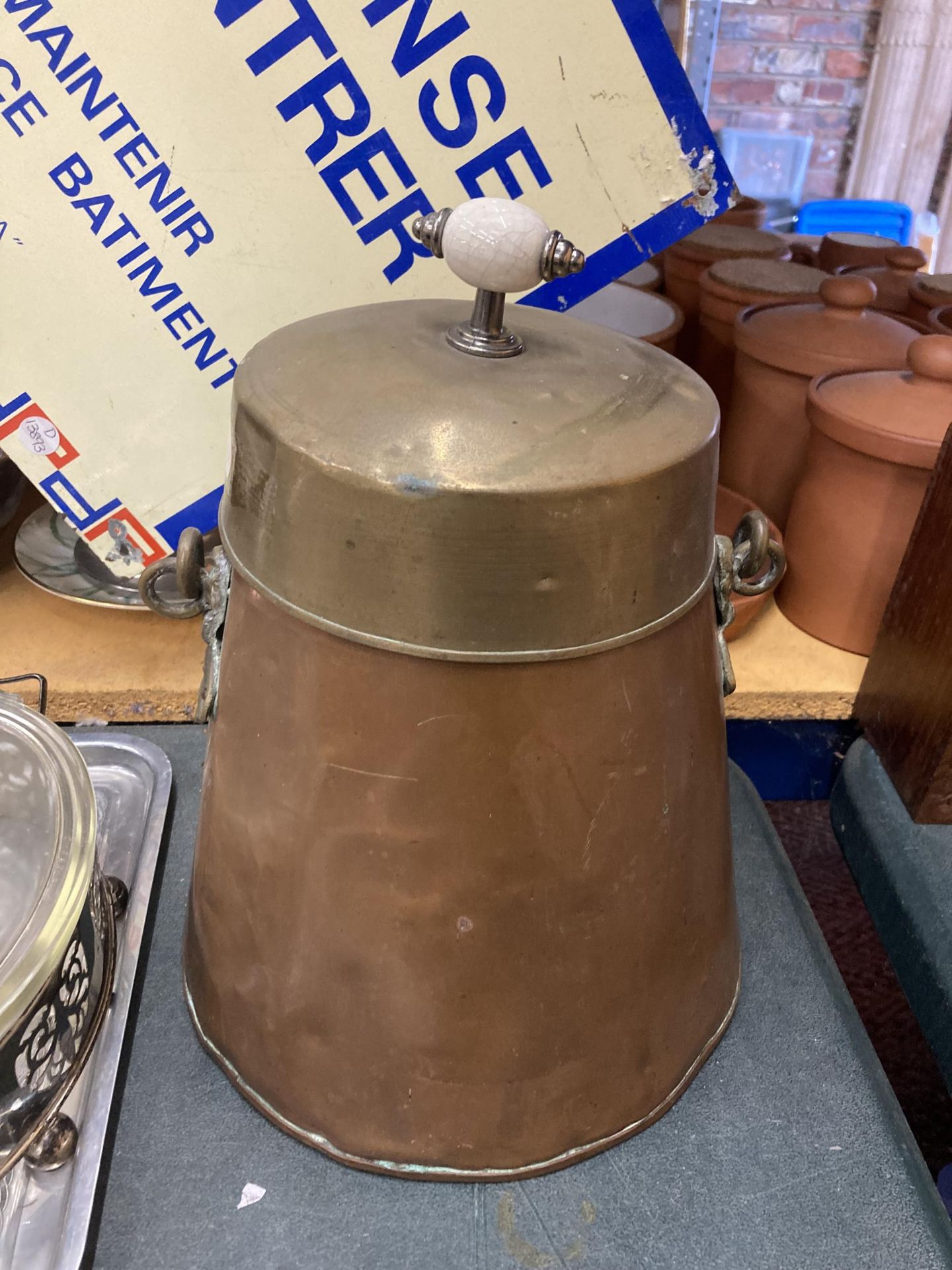 A DUTCH COPPER AND BRASS ASH PAN AND COVER WITH LID AND CERAMIC FINIAL, HEIGHT APPROX 31CM