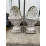 A PAIR OF WHITE PAINTED RECONSTITUTED STONE ACORN FINIALS