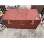 A LARGE WOODEN STORAGE TRUNK