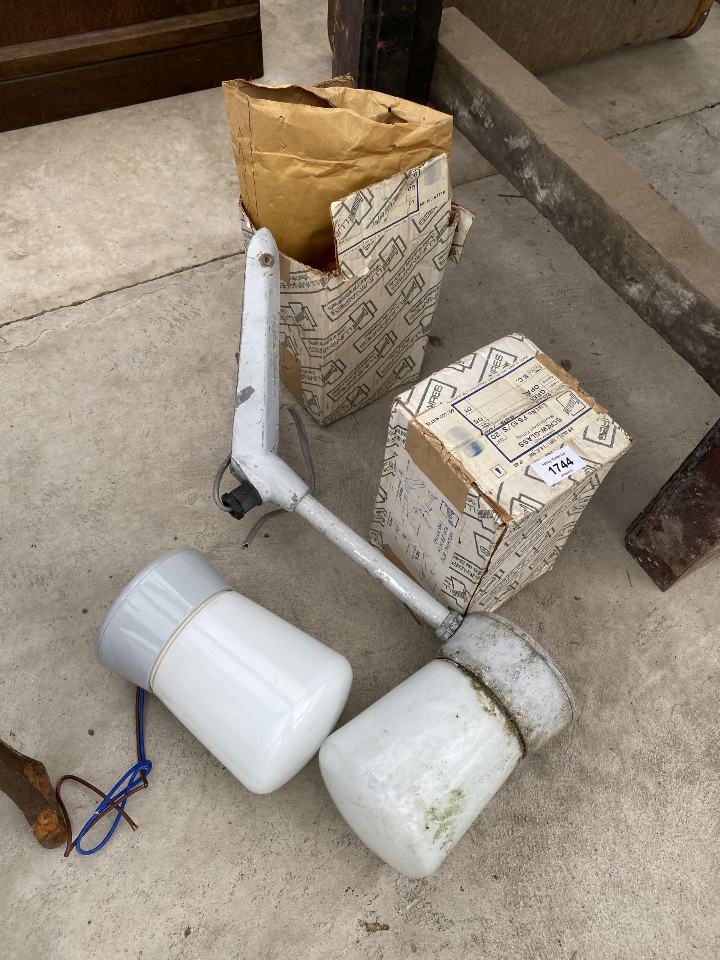 A COURTYARD LIGHT WITH CORNER BRACKET AND TWO FURTHER LIGHT FITTINGS