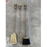 THREE BRASS COMPANION ITEMS TO INCLUDE SHOVEL, BRUSH AND POKER WITH BALL AND CLAW HANDLES