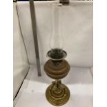 A VINTAGE BRASS AND COPPER OIL LAMP