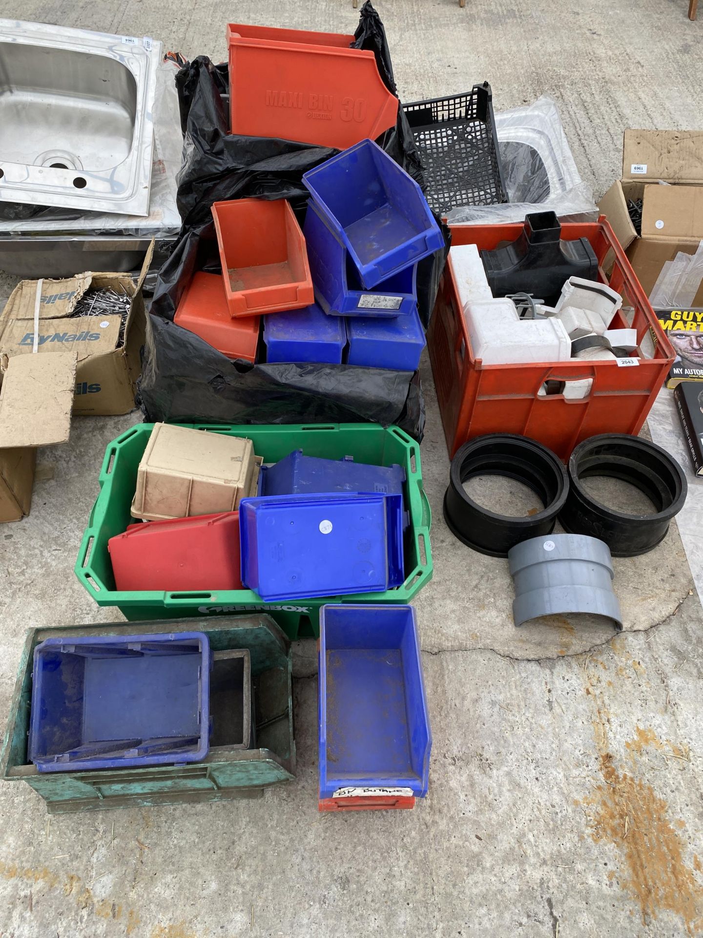 AN ASSORTMENT OF GUTTER FITTINGS AND PLASTIC LIN BINS ETC