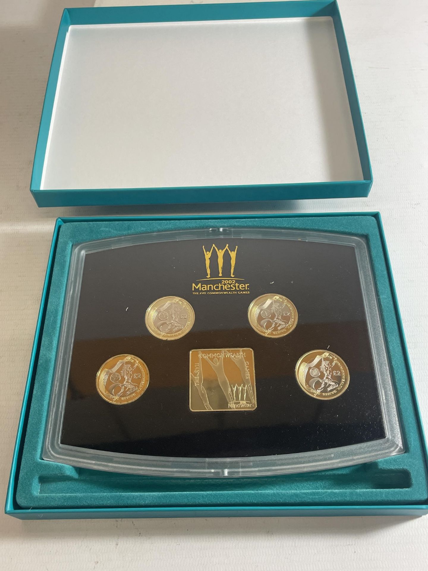 MANCHESTER 2002 , FOUR X £2 COIN SET , TO COMMEMORATE THE COMMONWEALTH GAMES . PRISTINE CONDITION .