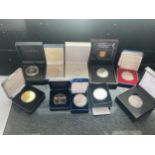 A SELECTION OF TEN BOXED MAINLY SILVER PROOF COINS