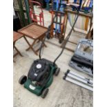 A PETROL ENGINE LAWN MOWER LACKING GRASS BOX