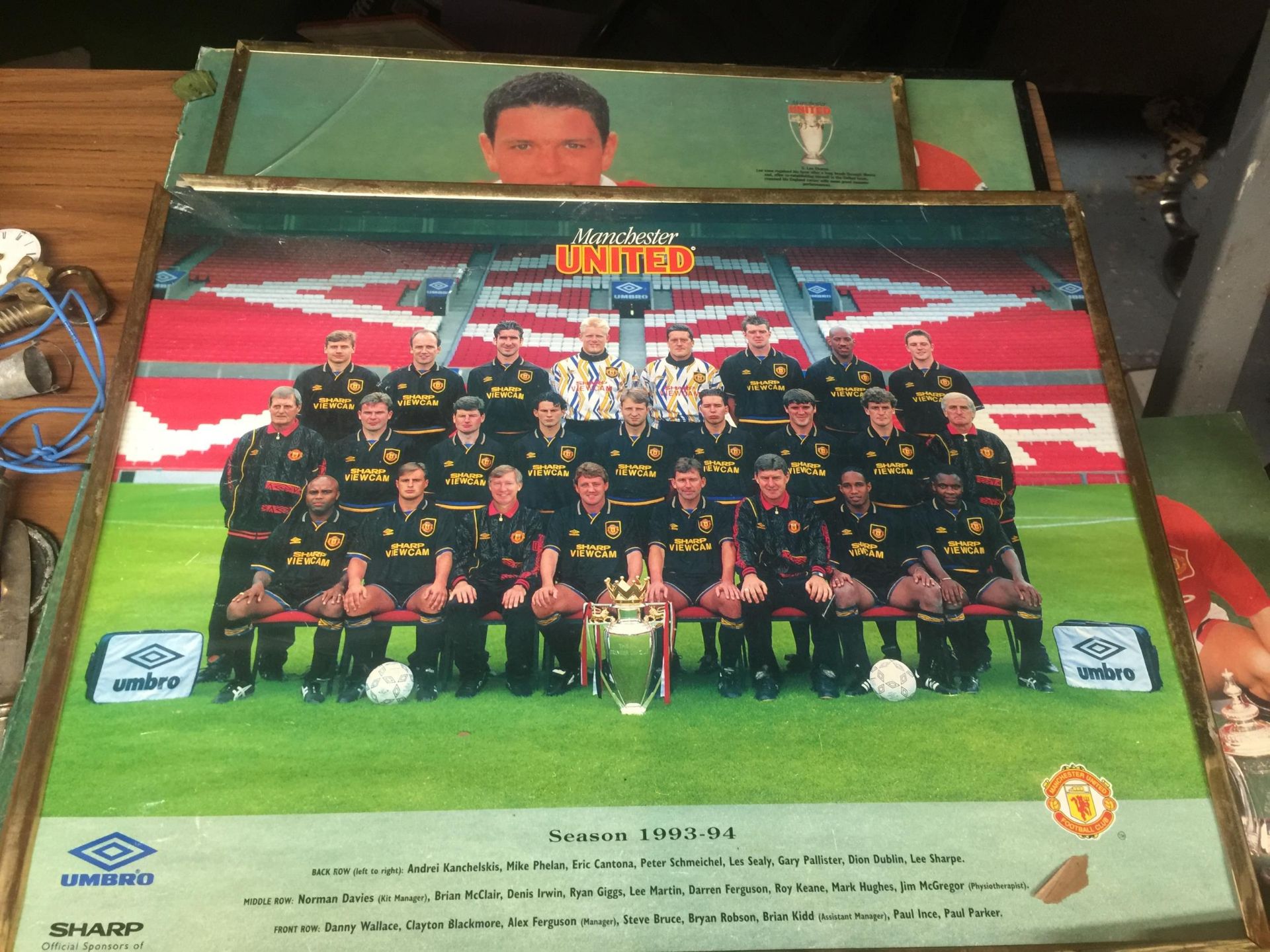 A GROUP OF FRAMED MANCHESTER UNITED PRINTS
