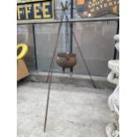 A VINTAGE CAST IRON COOKING POT WITH TRIPOD STEEL FRAME