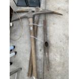 TWO WOODEN HANDLED PICK AXES AND A FURTHER PICK AXE HEAD