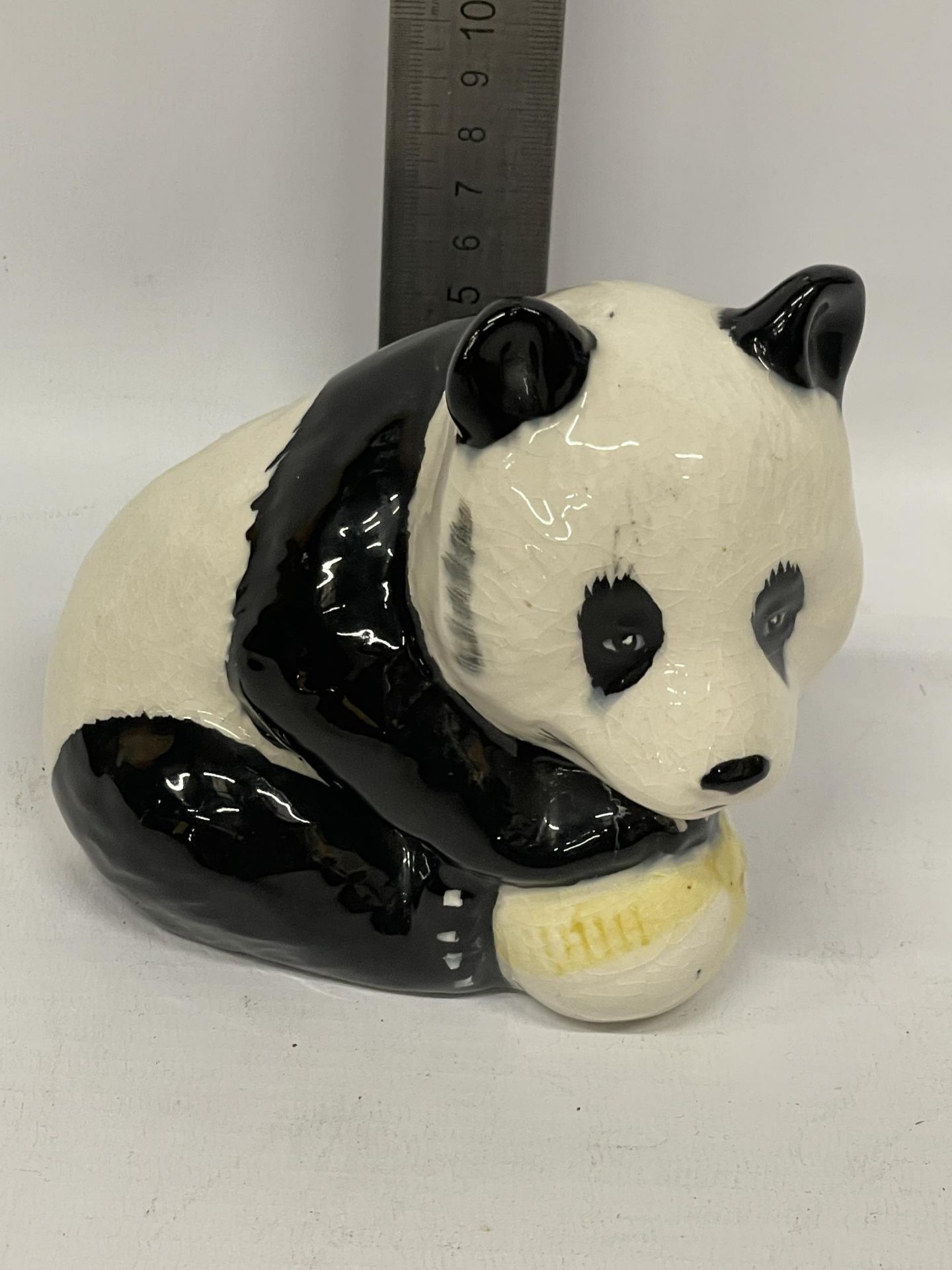 A BESWICK PANDA WITH A BALL