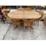 A PINE TWIN-PEDESTAL DINING TABLE, 71 X 38" AND SIX CHAIRS, TWO BEING CARVERS