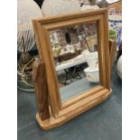 A VINTAGE PINE DRESSING TABLE MIRROR