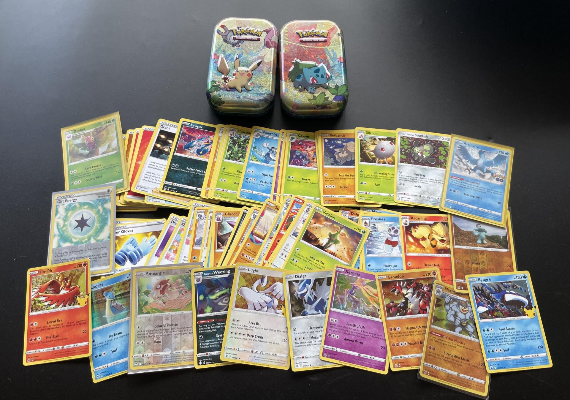 TWO TINS OF ASSORTED POKEMON CARDS, HOLOS ETC