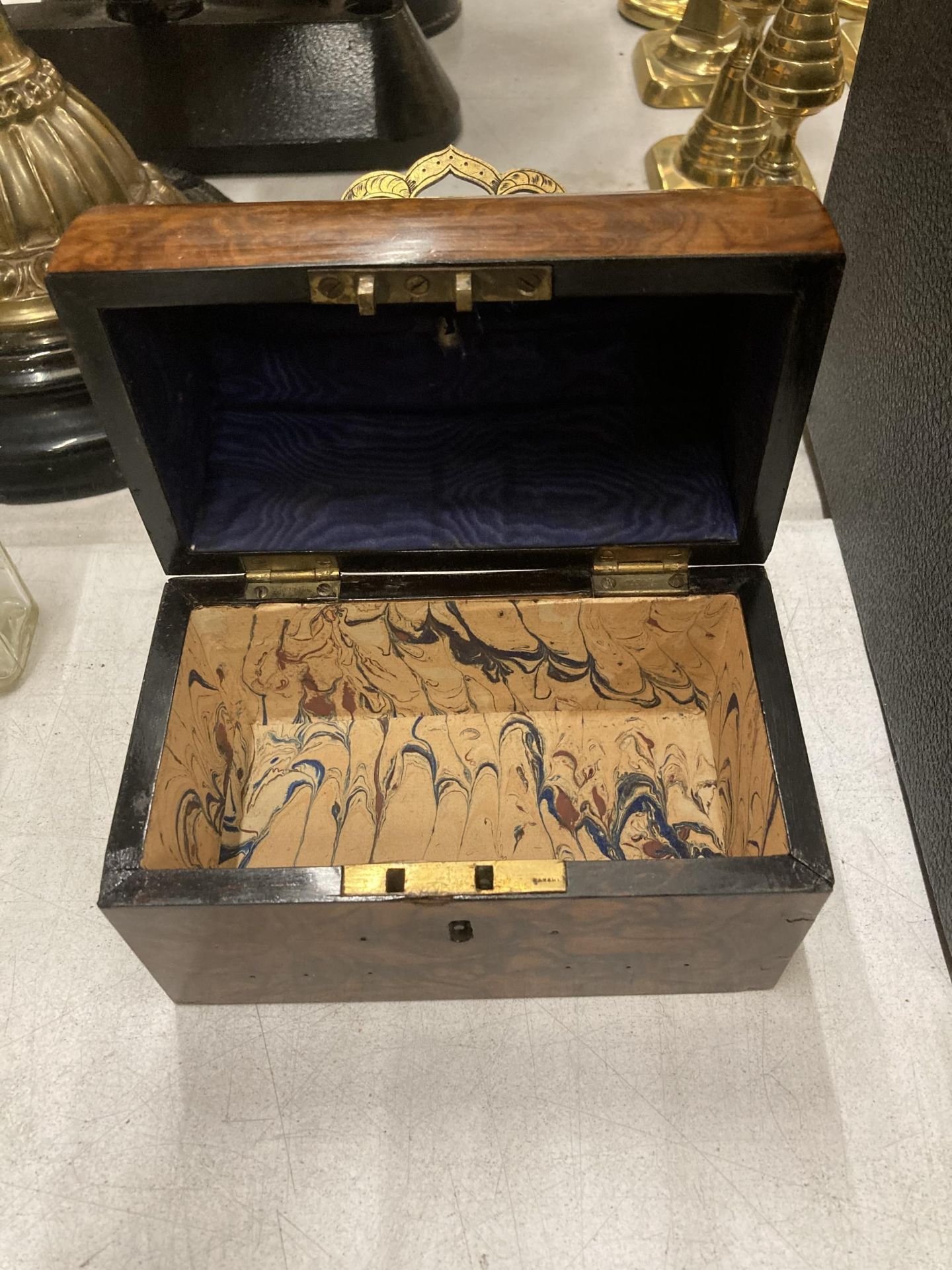 A VINTAGE WALNUT DOMED JEWELLERY BOX WITH BRASS HANDLE