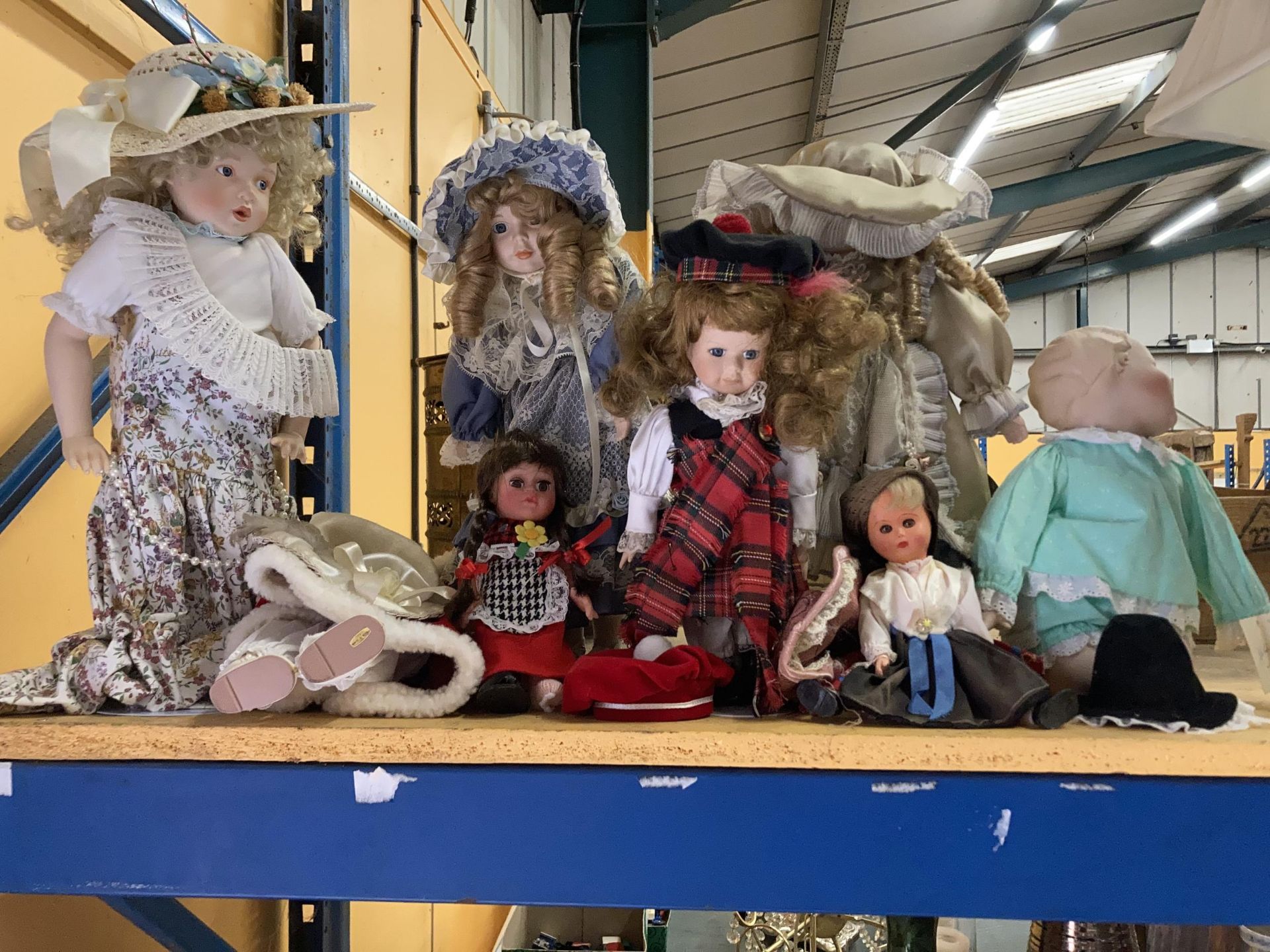 A QUANTITY OF COLLECTORS DOLLS, SOME ON STANDS - 8 IN TOTAL