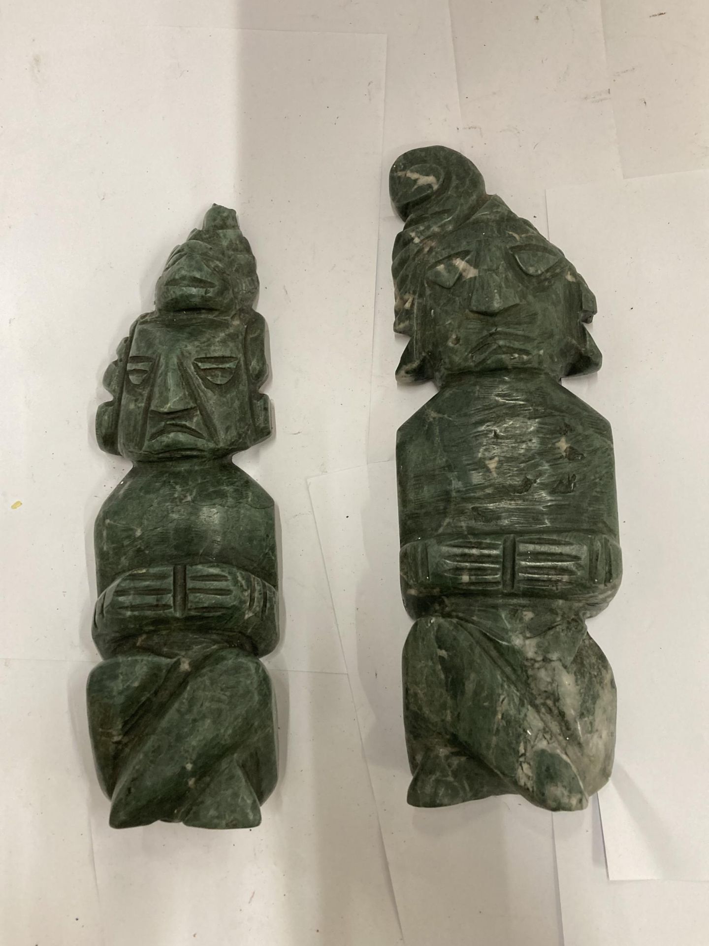 A PAIR OF MALACHITE TYPE STONE FIGURES