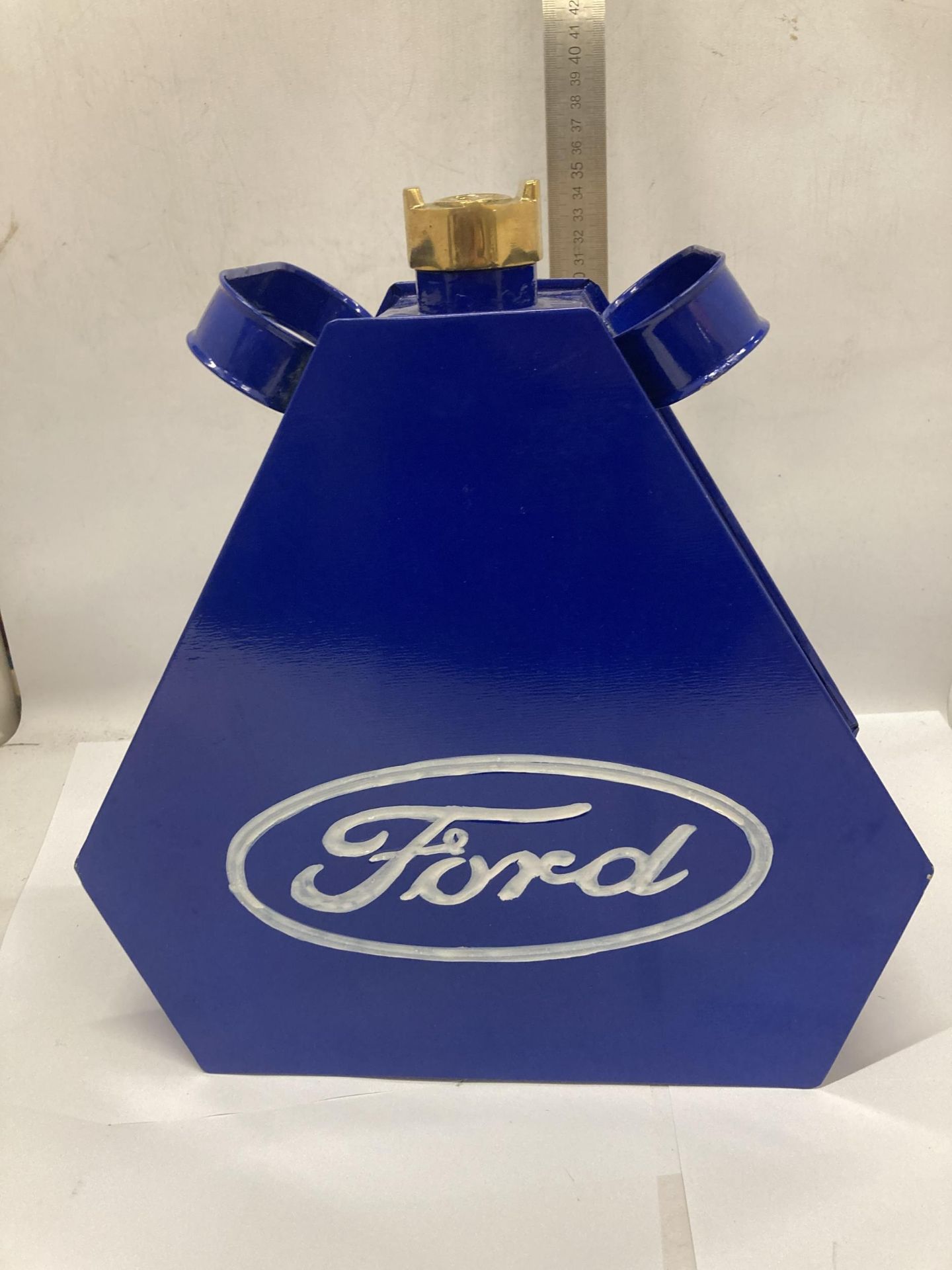 A BLUE FORD PETROL CAN