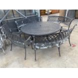 A LARGE CAST ALLOY PATIO FURNITURE SET COMPRISING OF A ROUND TABLE AND FOUR CURVED TWO SEATER