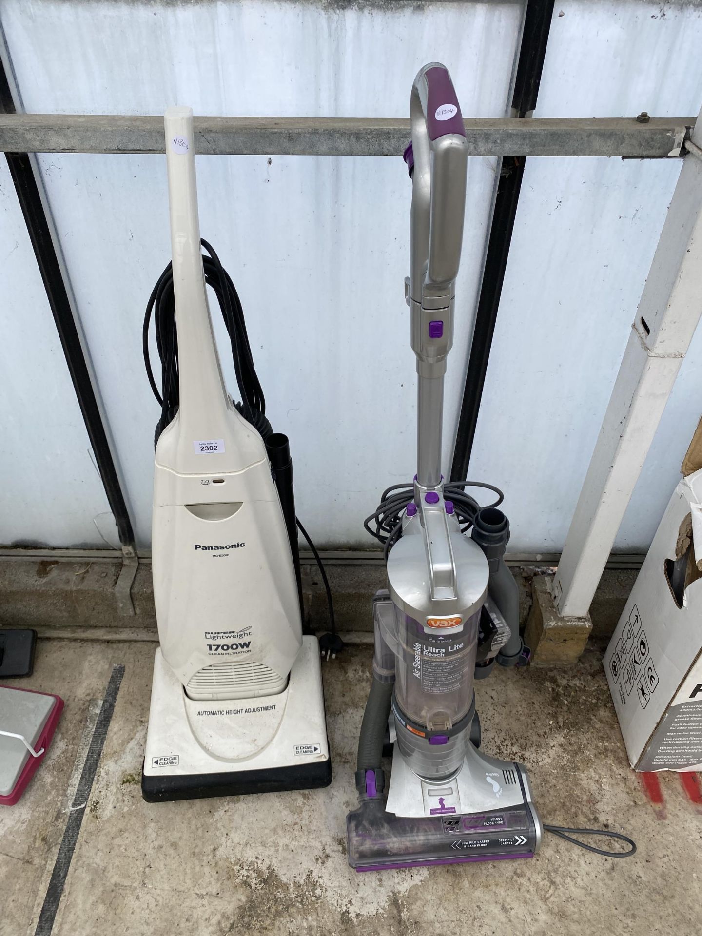 A PANASONIC LIGHTWEIGHT VACUUM CLEANER AND A VAX ULTRA LITE REACH VACUUM CLEANER