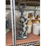 A VINTAGE CAST IRON CHERUB DESIGN DOORSTOP