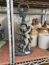 A VINTAGE CAST IRON CHERUB DESIGN DOORSTOP