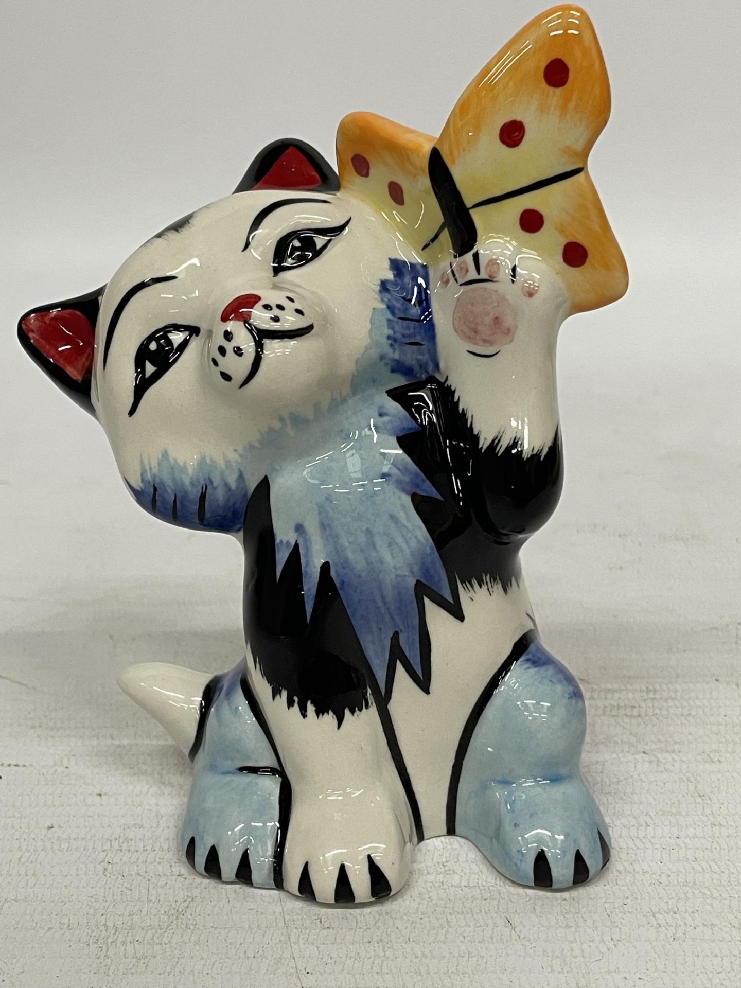 A LORNA BAILEY HAND PAINTED AND SIGNED CAT BUTTERFLY