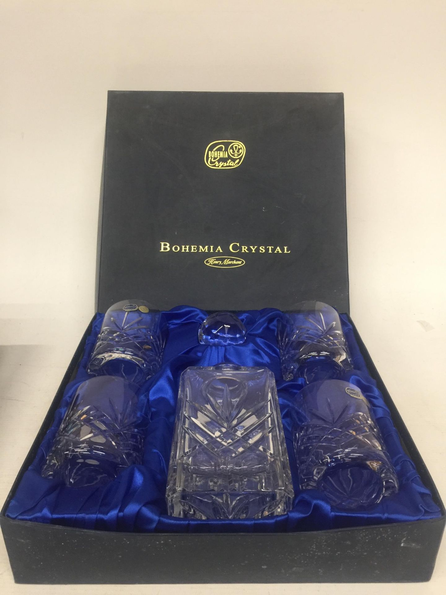A BOHEMIA CRYSTAL DECANTER WITH FOUR WHISKY TUMBLERS IN A PRESENTATION BOX
