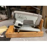A VINTAGE LMR SEWING MACHINE IN CASE