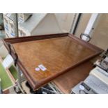 A LARGE VINTAGE WOODEN SERVING TRAY WITH METAL HANDLES