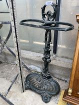 A VINTAGE CAST IRON UMBRELLA/STICK STAND WITH DRIP TRAY