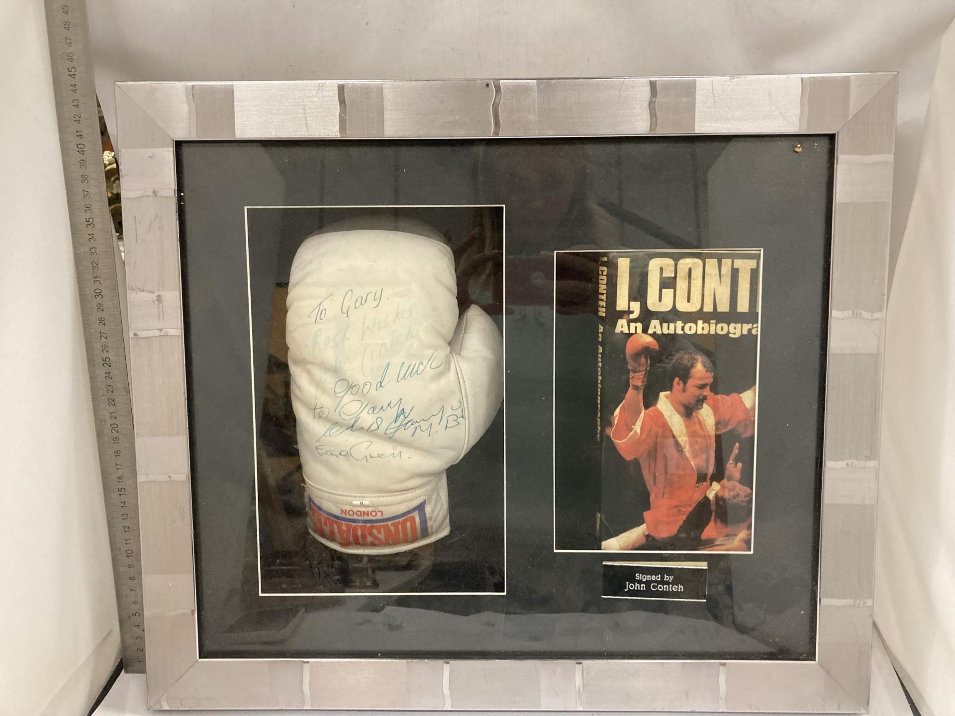 A FRAMED & SIGNED JOHN CONTEH BOXING GLOVE & AUTOBIOGRAPHY BOOK
