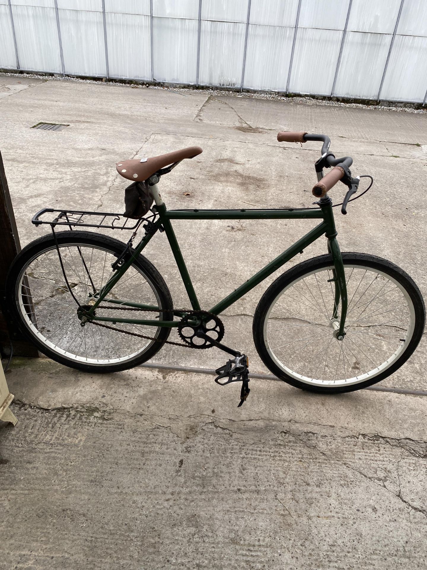 A VINTAGE GENTS BIKE WITH LEATHER SEAT