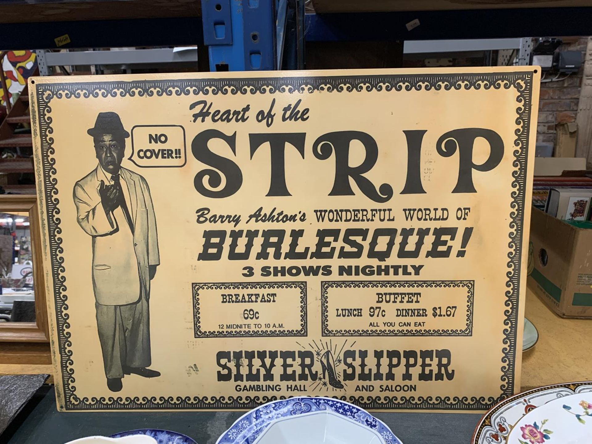 A LARGE USA METAL SIGN 'SILVER SLIPPER STRIP CLUB', 50CM X 70CM