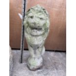 A SMALL RECONSTITUTED STONE FIGURE OF A SEATED LION (H:50CM)