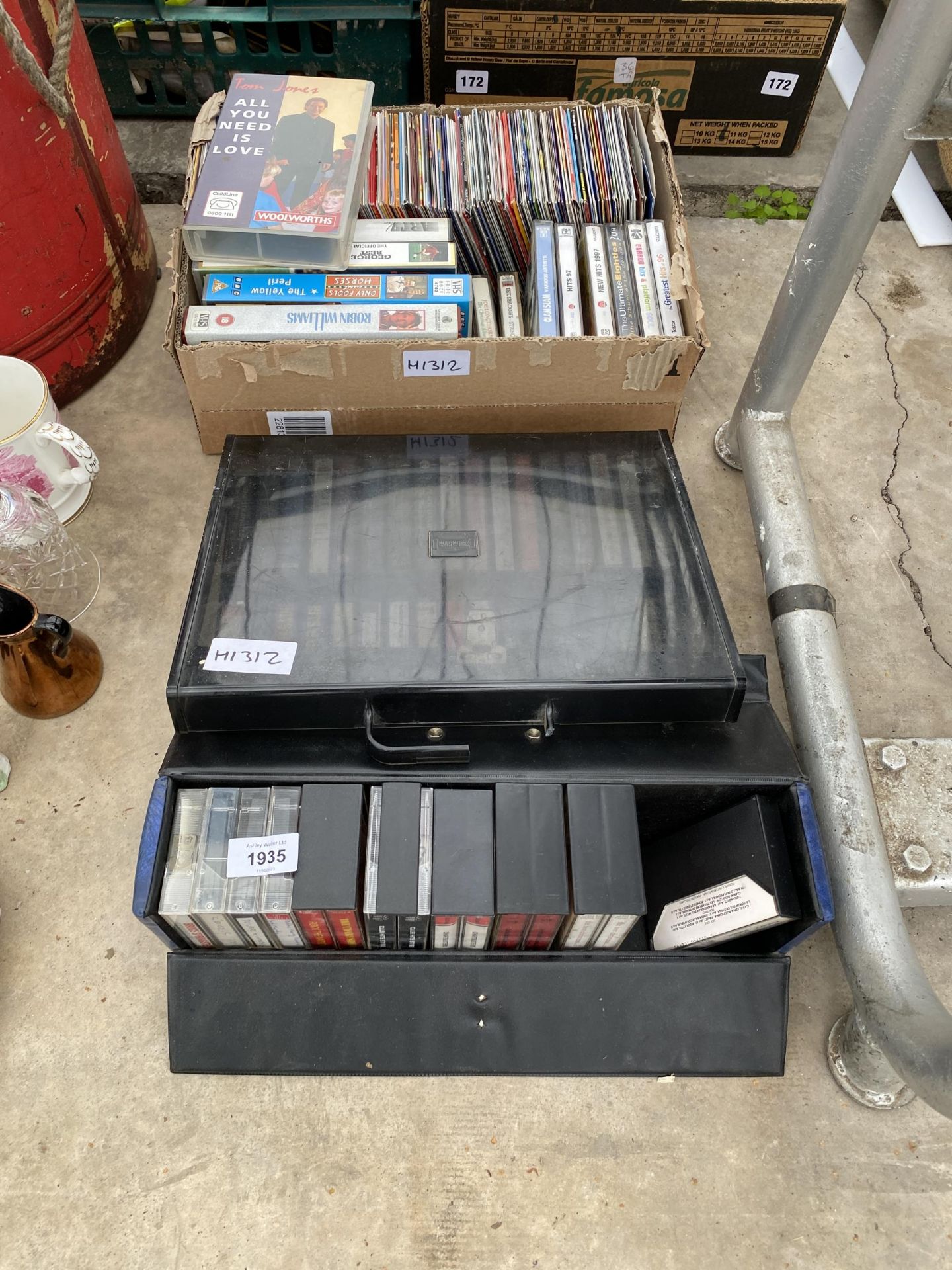 AN ASSORTMENT OF CASSETTES, CDS AND VHS VIDEOS